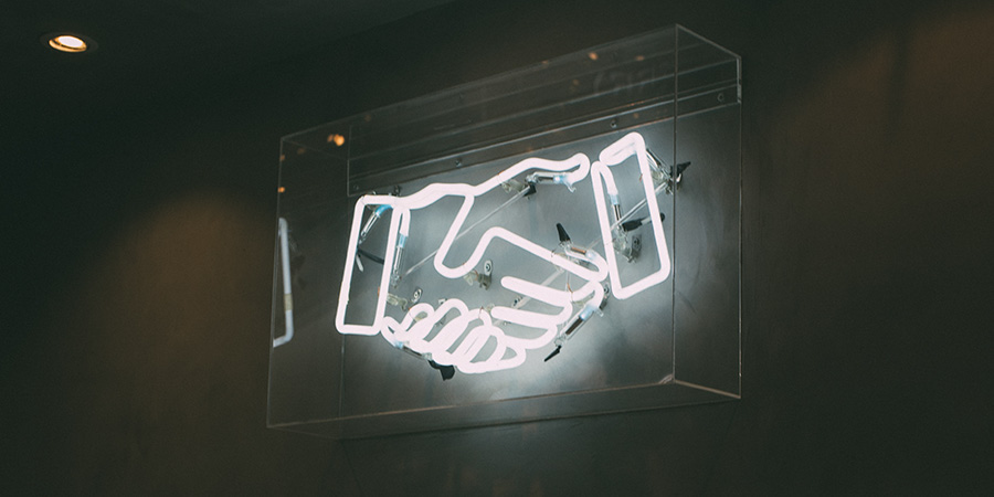 shaking hands Importance of Trust article header